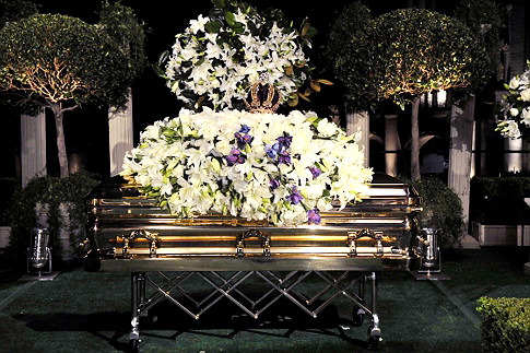 Michael Jackson's casket was topped with a jeweled crown by his children Prince and Paris during his burial service at Forest Lawn Memorial Park in Glendale, Calif.